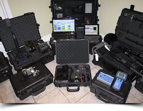 Flight cases of detection instruments opened out before a sweep